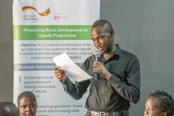 Tuku-Tuku facilitator leading a PRUDEV II programme session with partner staff